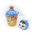Doll / jug with a cup