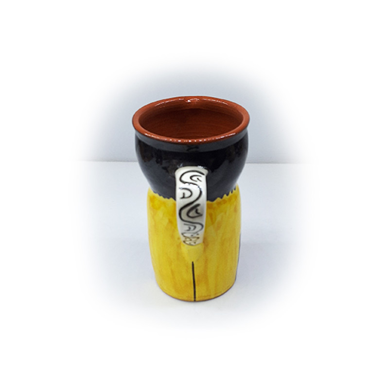 Ceramic pitcher with typical figure